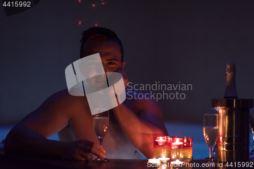 Image of man relaxing in the jacuzzi