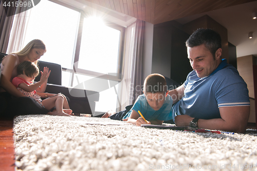 Image of young couple spending time with kids