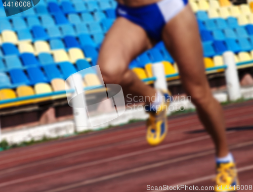 Image of Blurred athletic running competition at stadium not in focus
