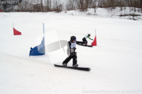 Image of Blurred view of snowboard giant parallel slalom competitions