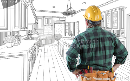 Image of Male Contractor with Hard Hat and Tool Belt Looking At Custom Ki