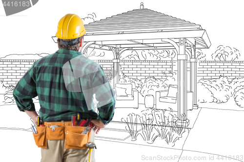 Image of Contractor Standing Looking At Patio Pergola Design Drawing.