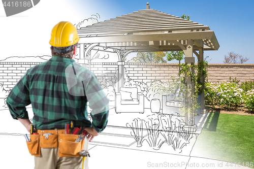 Image of Contractor Standing Looking At Patio Pergola Design Drawing and 