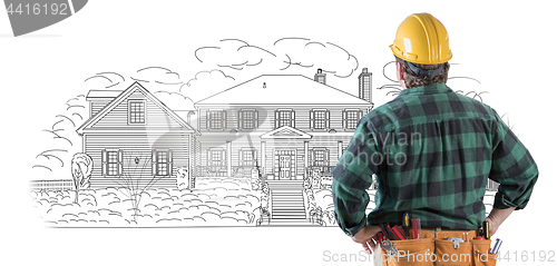 Image of Male Contractor with Hard Hat and Tool Belt Looking At Custom Ho