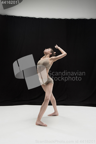 Image of Young teen dancer on white floor background.