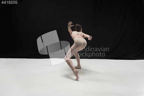 Image of Young teen dancer on white floor background.