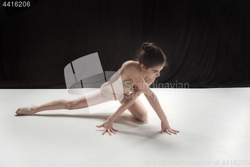 Image of Young teen dancer on white floor background.