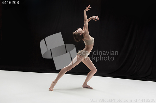 Image of Young teen dancer on white floor background.