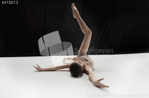 Image of Young teen dancer on white floor background.