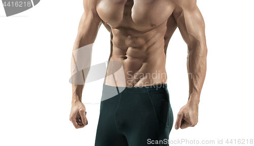 Image of Attractive male body builder on blue background