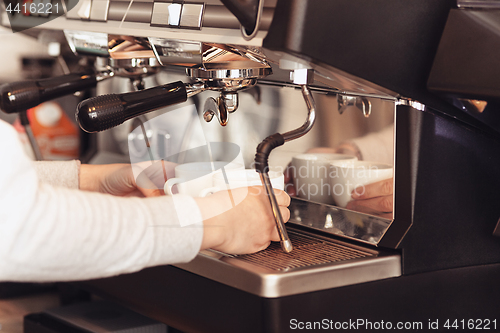 Image of Barista, cafe, making coffee, preparation and service concept