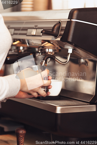 Image of Barista, cafe, making coffee, preparation and service concept