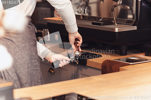 Image of Barista, cafe, making coffee, preparation and service concept