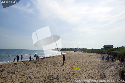 Image of editorial girl flying kite Ditch Plains Beach Montauk New York