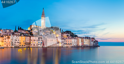 Image of Colorful sunset of Rovinj town, Croatian fishing port on the west coast of the Istrian peninsula.