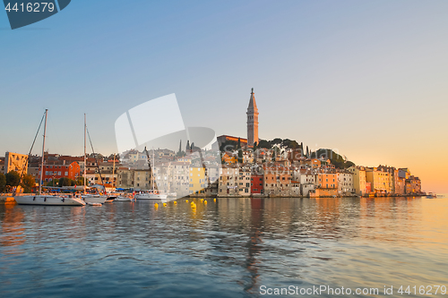 Image of Colorful sunset of Rovinj town, Croatian fishing port on the west coast of the Istrian peninsula.