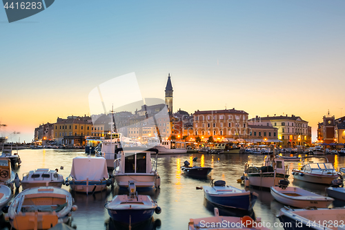 Image of Colorful sunset of Rovinj town, Croatian fishing port on the west coast of the Istrian peninsula.