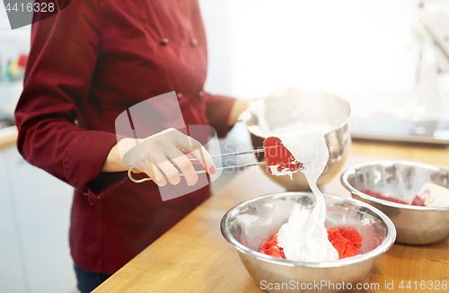 Image of chef making macaron batter at kitchen