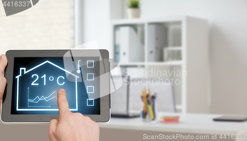 Image of tablet pc with smart home settings on screen