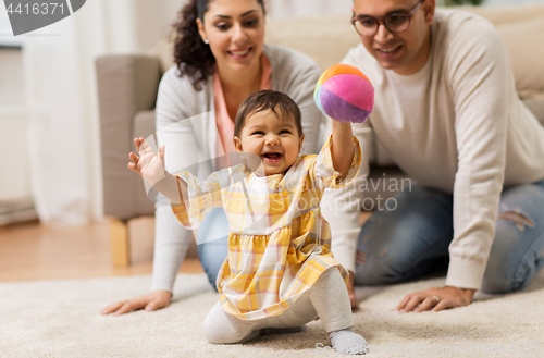 Image of happy family and baby daugter playing at home