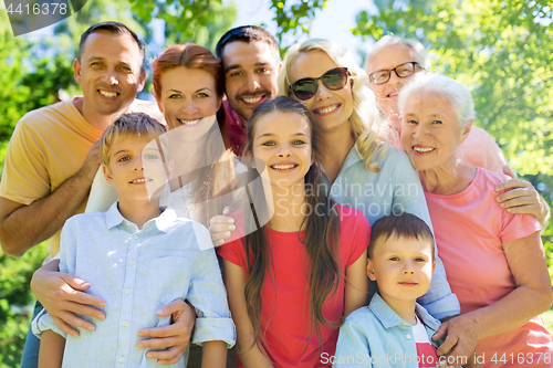 Image of happy family portrait in summer garden