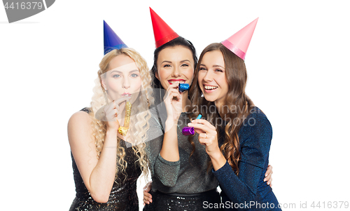 Image of happy women with party caps hugging
