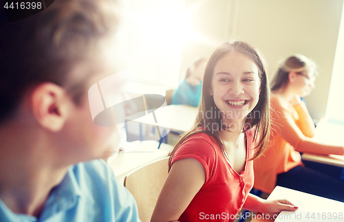 Image of group of happy students talking at school break