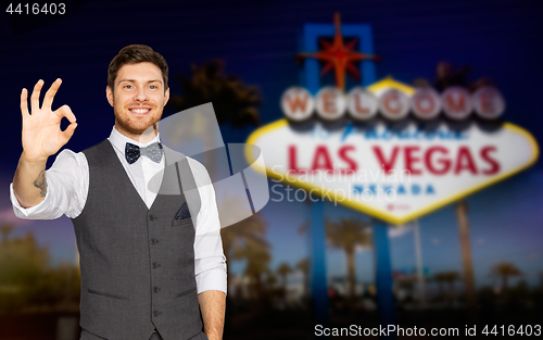 Image of young man in suit showing ok sign at las vegas