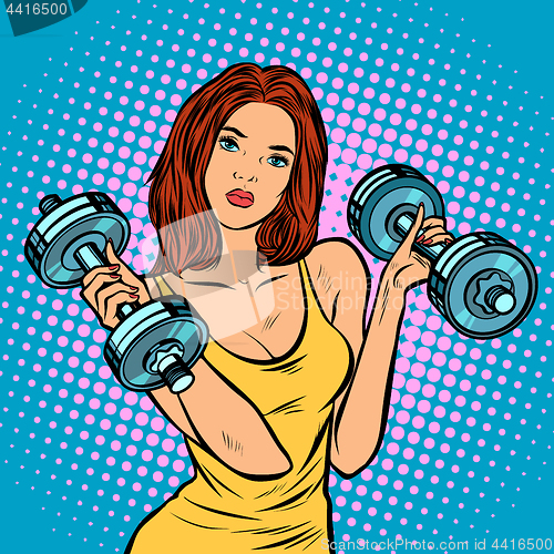 Image of beautiful woman with dumbbells in gym