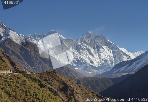 Image of Group of trekkers, stupa, Everest and Lhotse