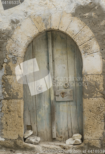 Image of Very old wooden arc door in arabian style