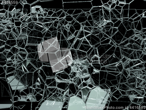 Image of Pieces of shattered or cracked glass on black