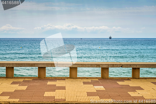 Image of Container ship at anchor on the horizon