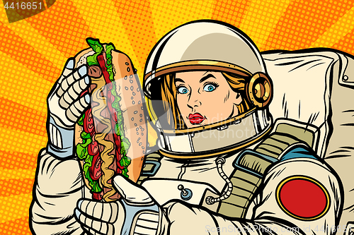 Image of Hungry woman astronaut with hot dog