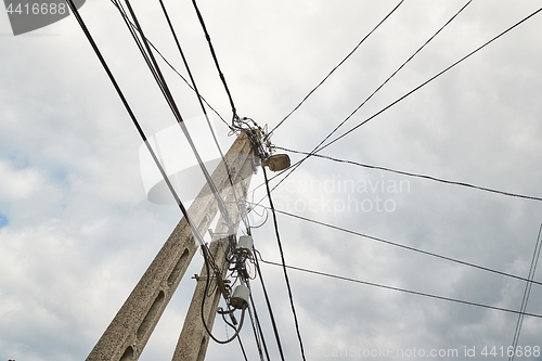 Image of Electric lines on wooden post