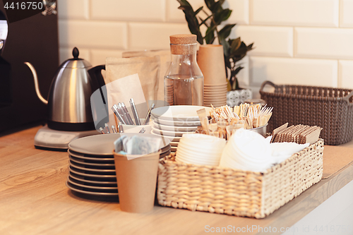 Image of A table setting for coffee on the counter at a coffee house