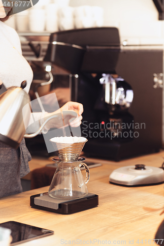 Image of Barista, cafe, making coffee, preparation and service concept