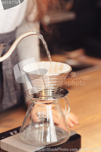 Image of Barista, cafe, making coffee, preparation and service concept