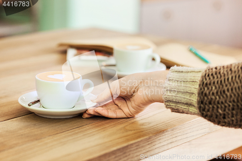 Image of A table setting for coffee on the counter at a coffee house