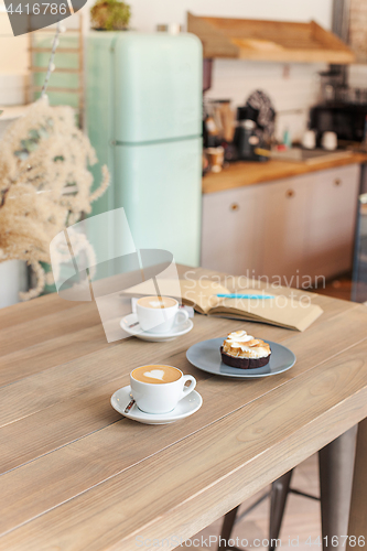 Image of A table setting for coffee on the counter at a coffee house