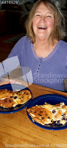 Image of Female eating pancakes.