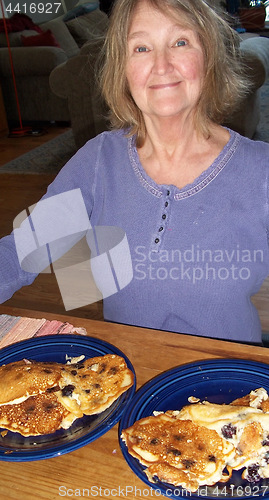 Image of Female eating pancakes.