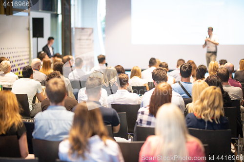 Image of Business speaker giving a talk at business conference event.