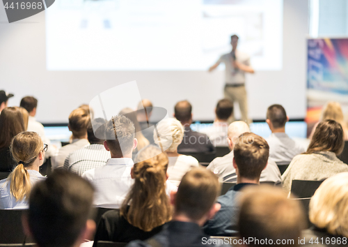 Image of Business speaker giving a talk at business conference event.