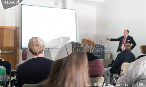 Image of Business speaker giving a talk at business conference event.