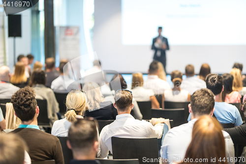 Image of Business speaker giving a talk at business conference event.