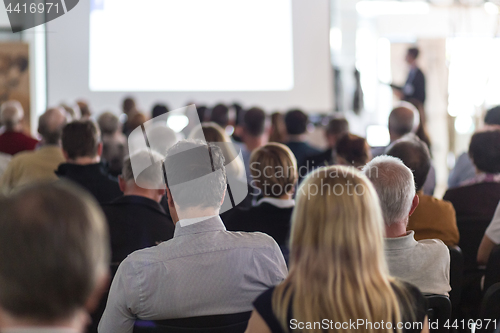 Image of Business speaker giving a talk at business conference event.