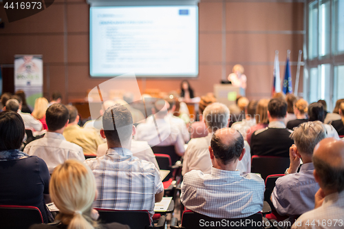 Image of Woman giving presentation on business conference.