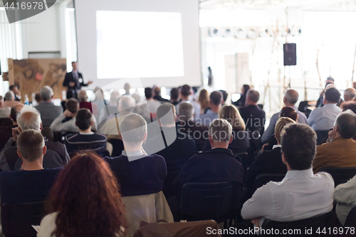 Image of Business speaker giving a talk at business conference event.