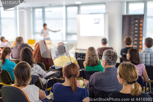 Image of Speaker giving presentation on business conference.